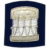 Embroidered silver wire on navy blue cloth drum insignia badge