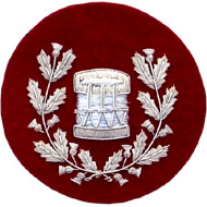 Embroidered silver wire on red cloth wreathed drum Drum Major insignia badge