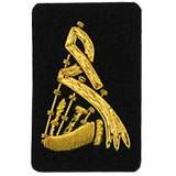 Embroidered gold wire on black cloth bagpipes insignia badge